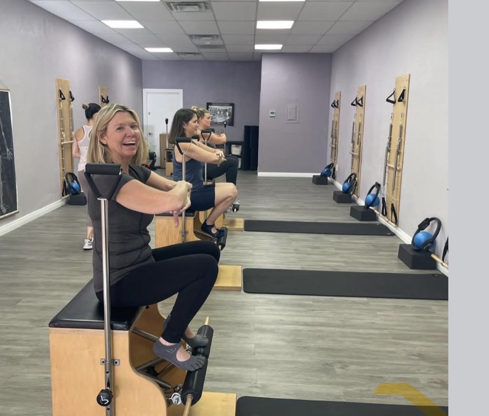 A client on the Wunda chair, with the springboard wall behind her