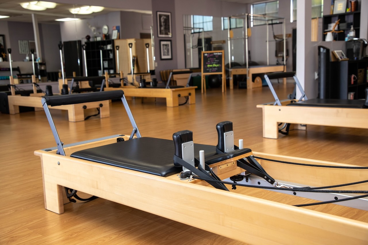 The Love Pilates studio floor, lined with reformers